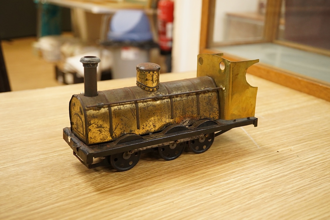 Seven Gauge One coarse scale railway freight wagons, by Bassett-Lowke, etc., including tinplate and wooden examples in liveries for LNWR, Midland Railway, and LBSCR, together with the remains of a scarce late 19th centur